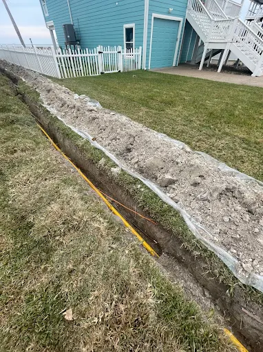 Gas line trench — waterfront home