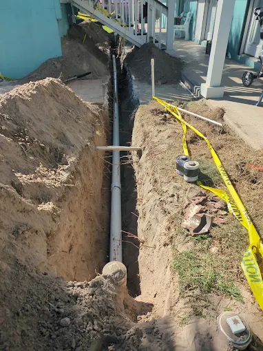 Sewer line replacement — alongside the house